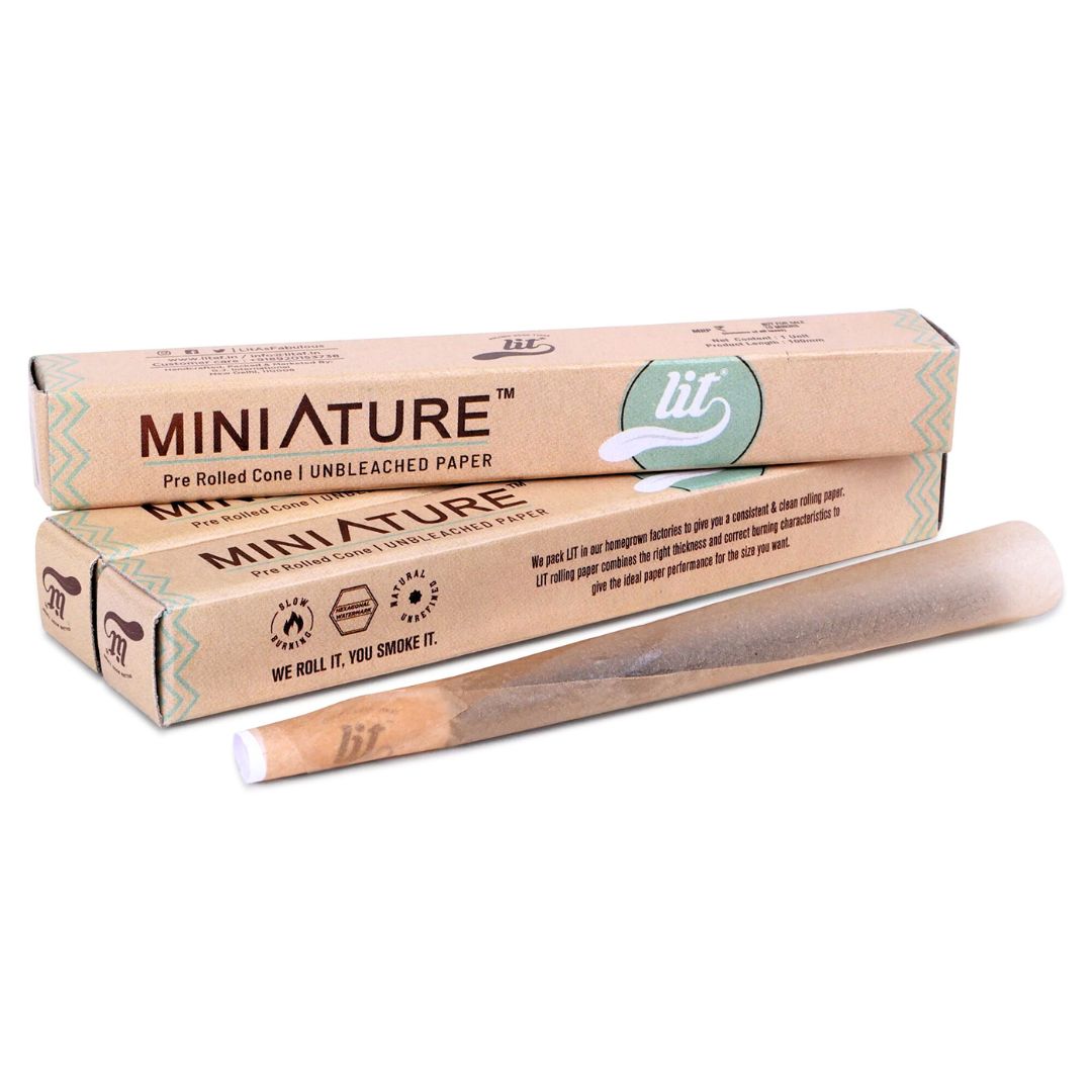 Two boxes of miniature pre-rolled cones with a rolled cone